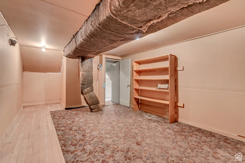 Finished basement with wood finished floors
