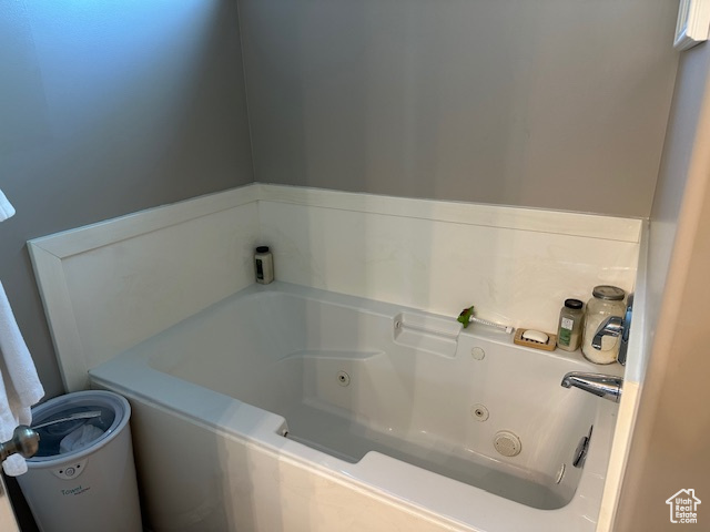 Full bath with a tub with jets