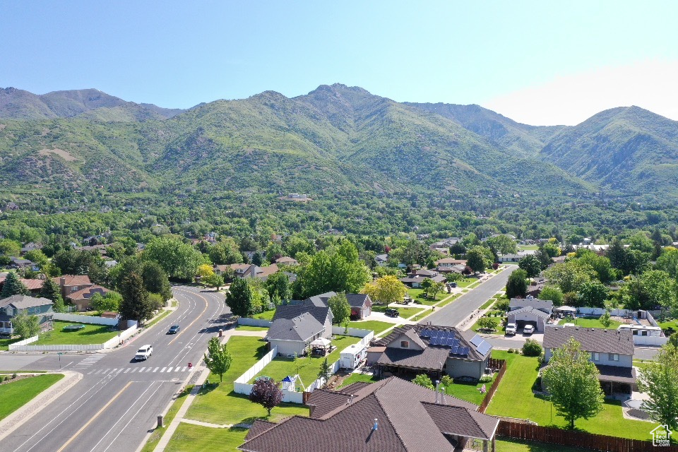 Aerial perspective of suburban area with a mountainous background