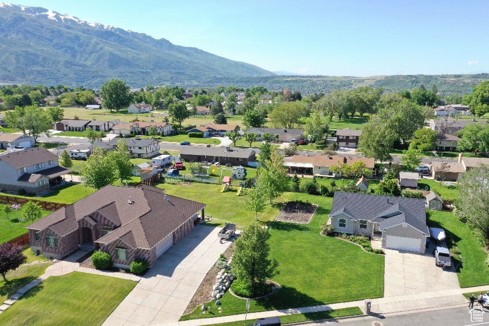 Aerial view of residential area featuring mountains