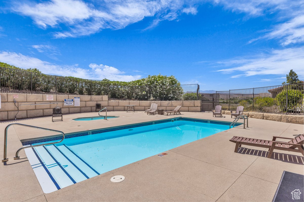 Community pool featuring a patio area
