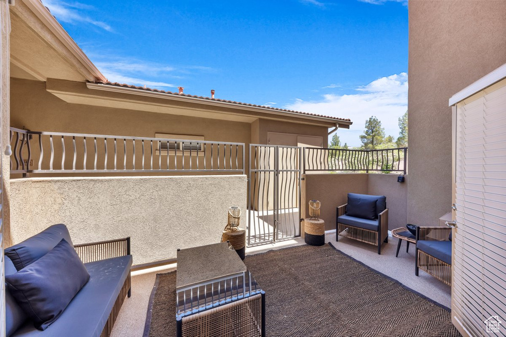 View of patio featuring a gate