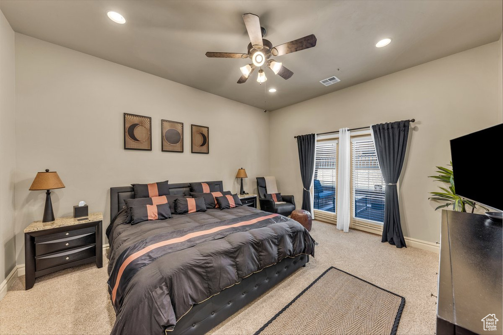 Bedroom featuring light carpet, baseboards, recessed lighting, and ceiling fan