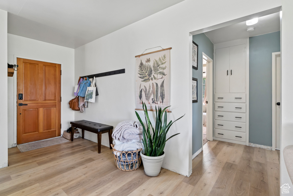 Foyer entrance with light wood finished floors