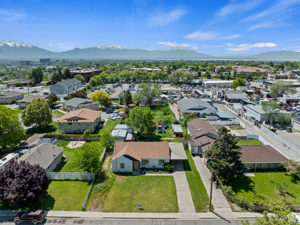 Aerial perspective of suburban area featuring a mountain backdrop