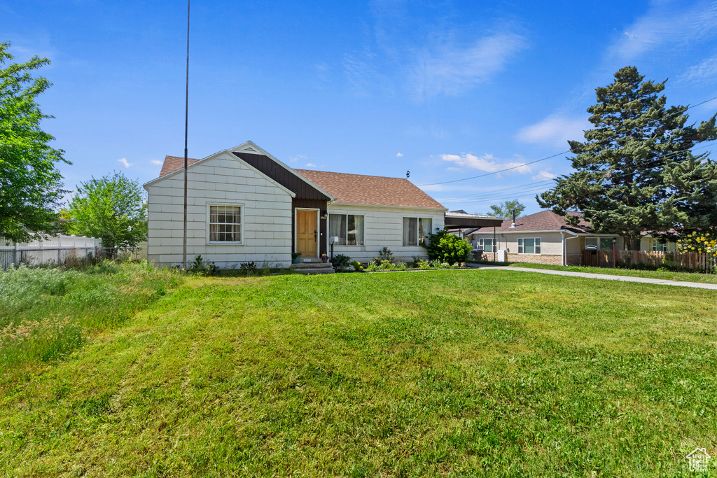 View of front of home featuring an attached carport