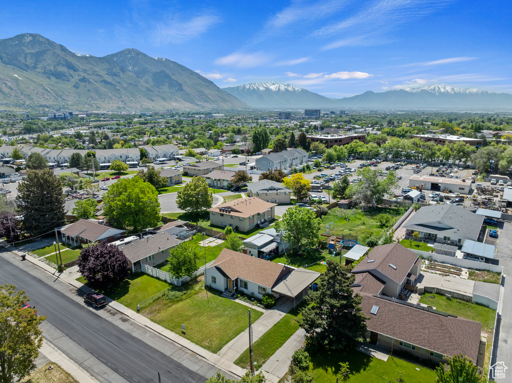 Aerial perspective of suburban area featuring a mountainous background