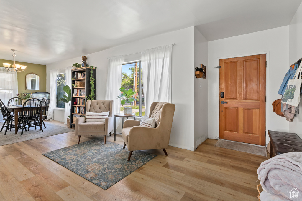 Sitting room featuring a chandelier and wood finished floors