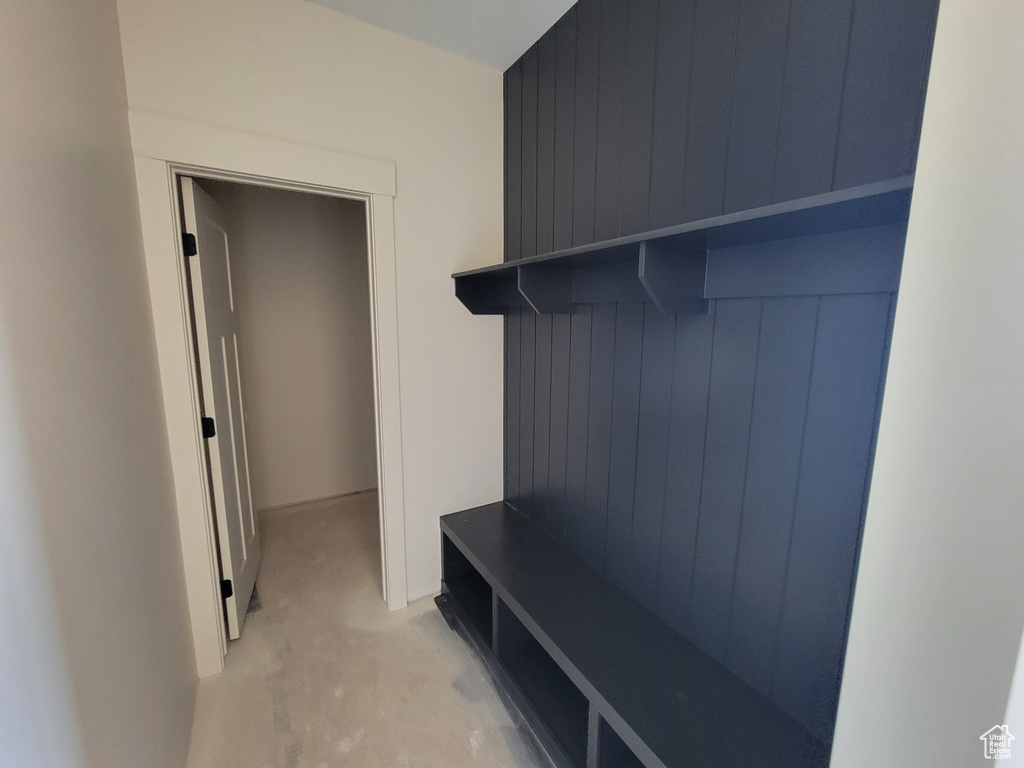 Mudroom with light colored carpet
