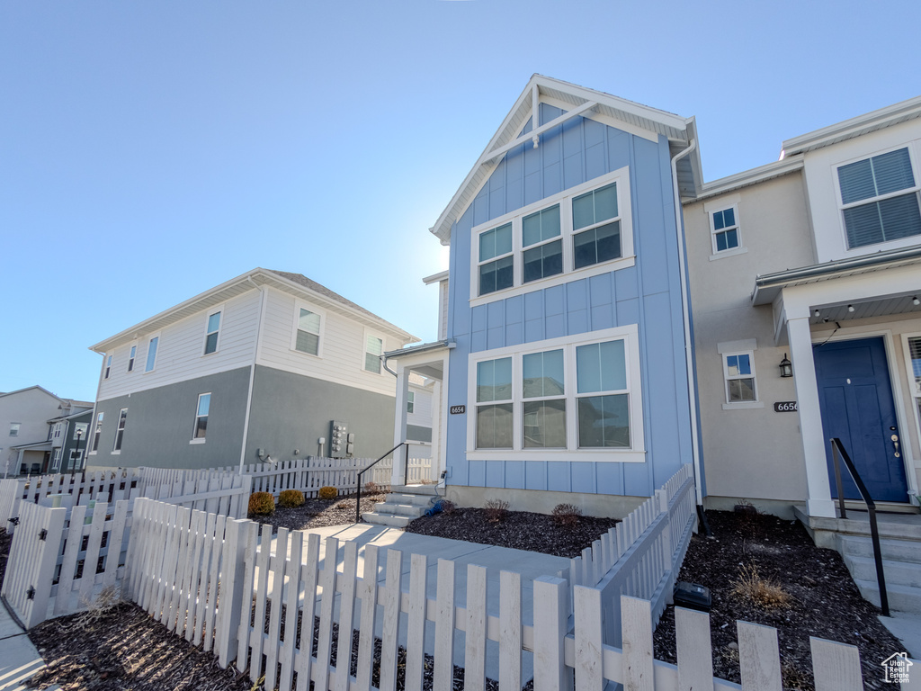 View of front of property with board and batten siding