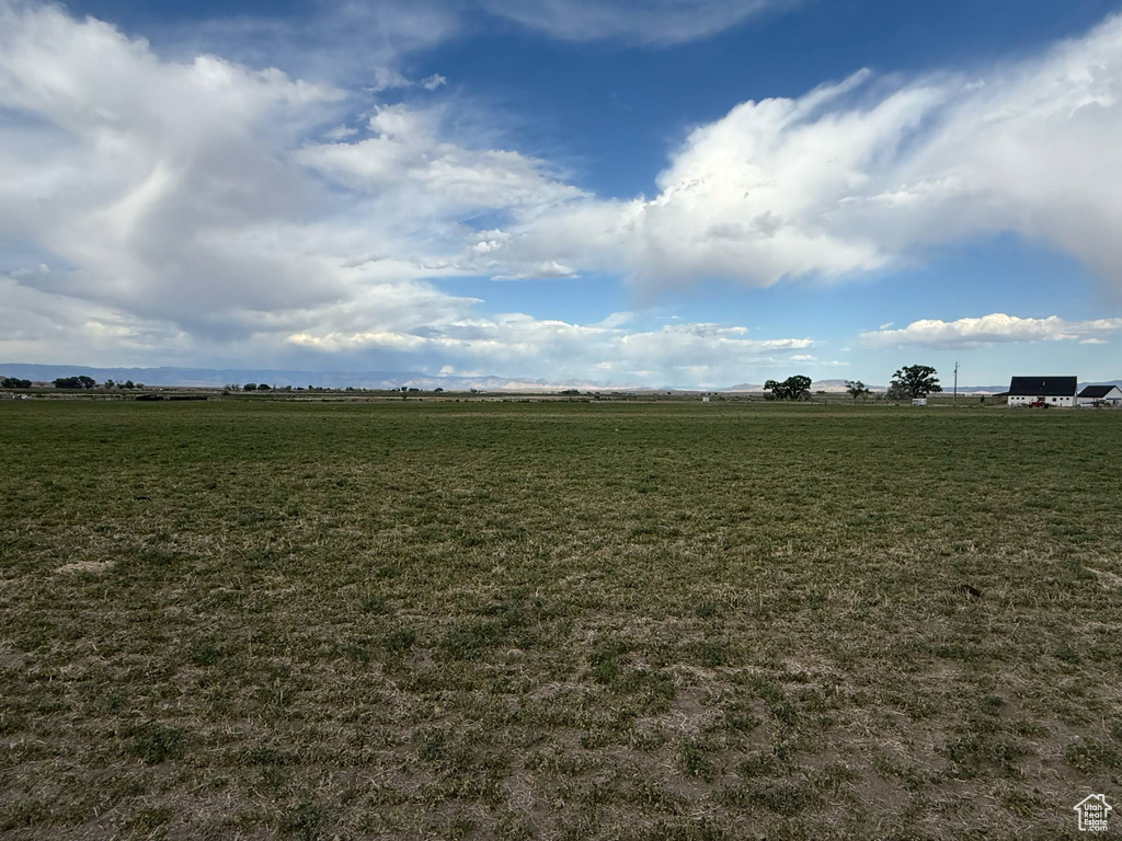 View of green lawn featuring a view of rural / pastoral area