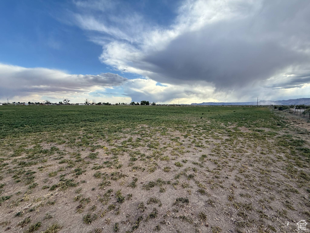 View of yard with a rural view