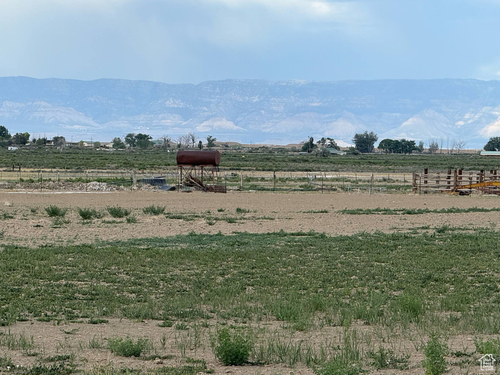 View of mountain backdrop with rural landscape