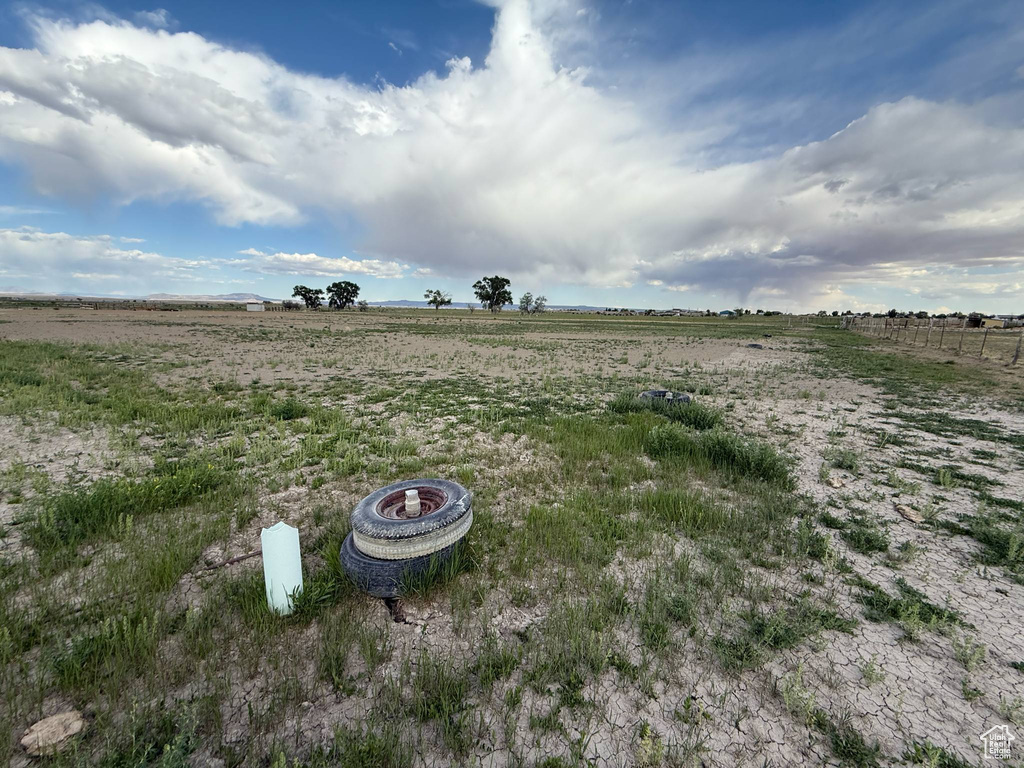 View of yard with a rural view