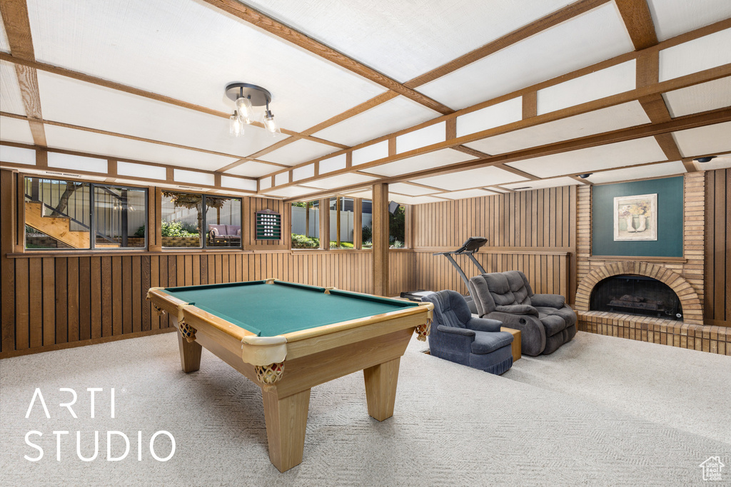Playroom with carpet floors, billiards table, and a brick fireplace