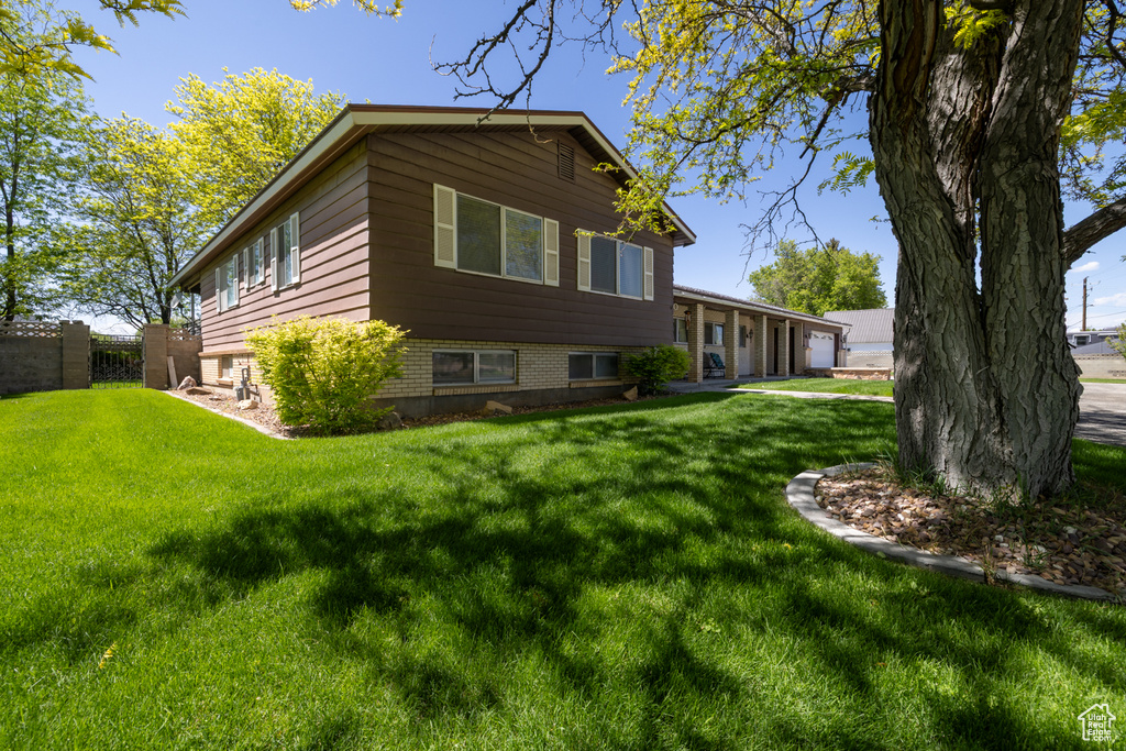 View of side of property with a garage