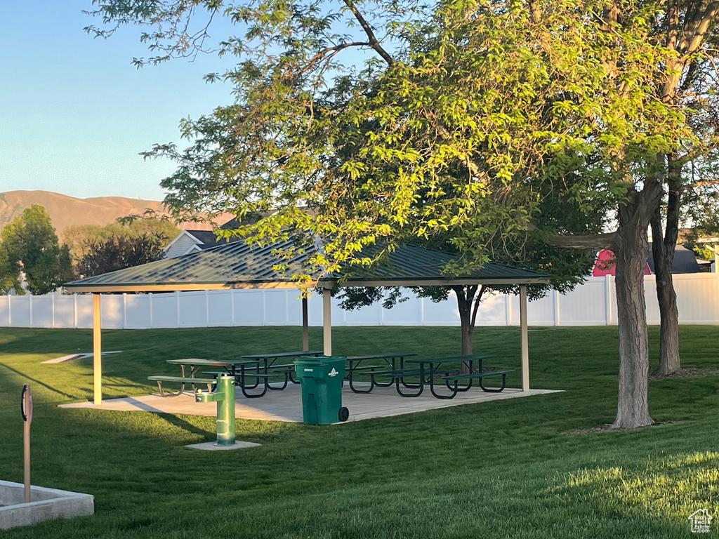 Surrounding community with a gazebo and a mountain view
