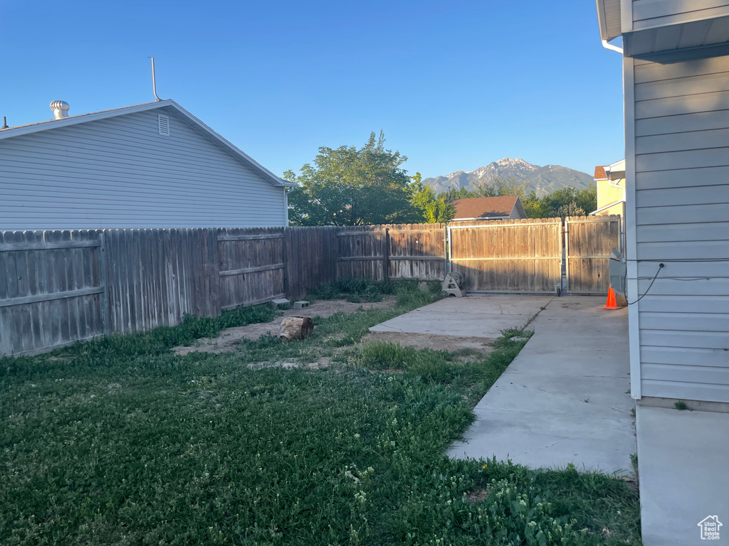 View of yard featuring a patio area and a mountain view