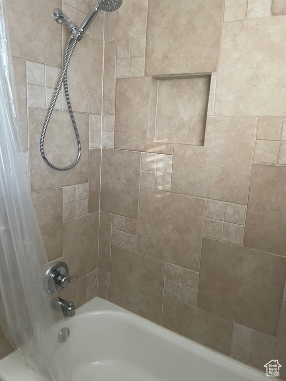 Full bath featuring shower / bath combo