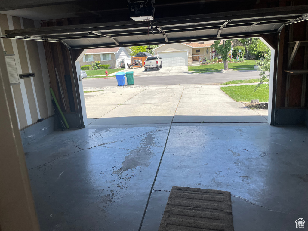 Garage featuring a garage door opener