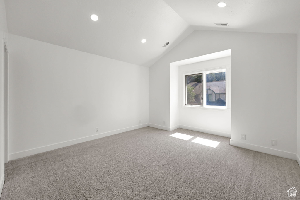 Additional living space with vaulted ceiling, carpet floors, recessed lighting, and baseboards