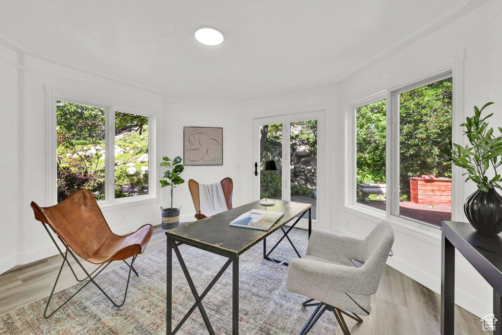Home office featuring light wood-style floors
