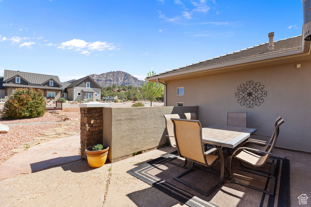 View of patio featuring a mountain view and outdoor dining area