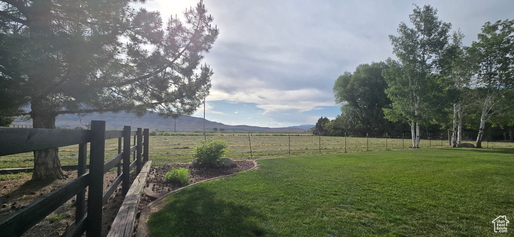 View of yard with a view of rural / pastoral area and a mountain view