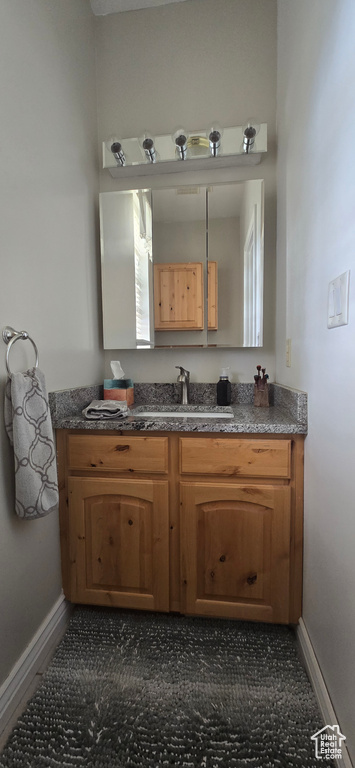 Bathroom with baseboards and vanity