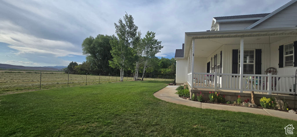 View of yard with a porch