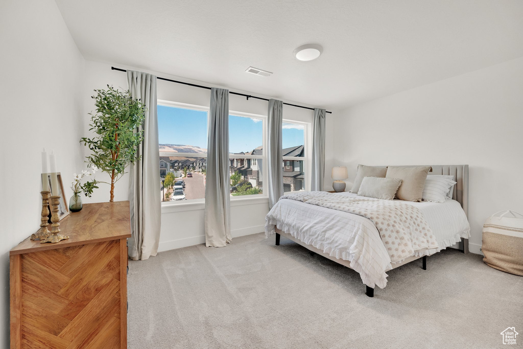Carpeted bedroom with baseboards
