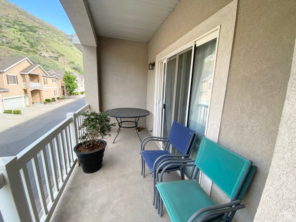 Balcony with a mountain view and a residential view