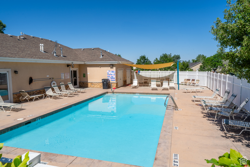 Community pool featuring a patio area
