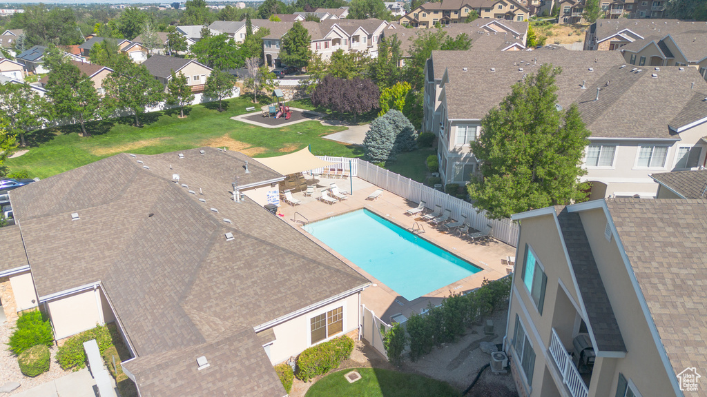 Aerial perspective of suburban area featuring a pool