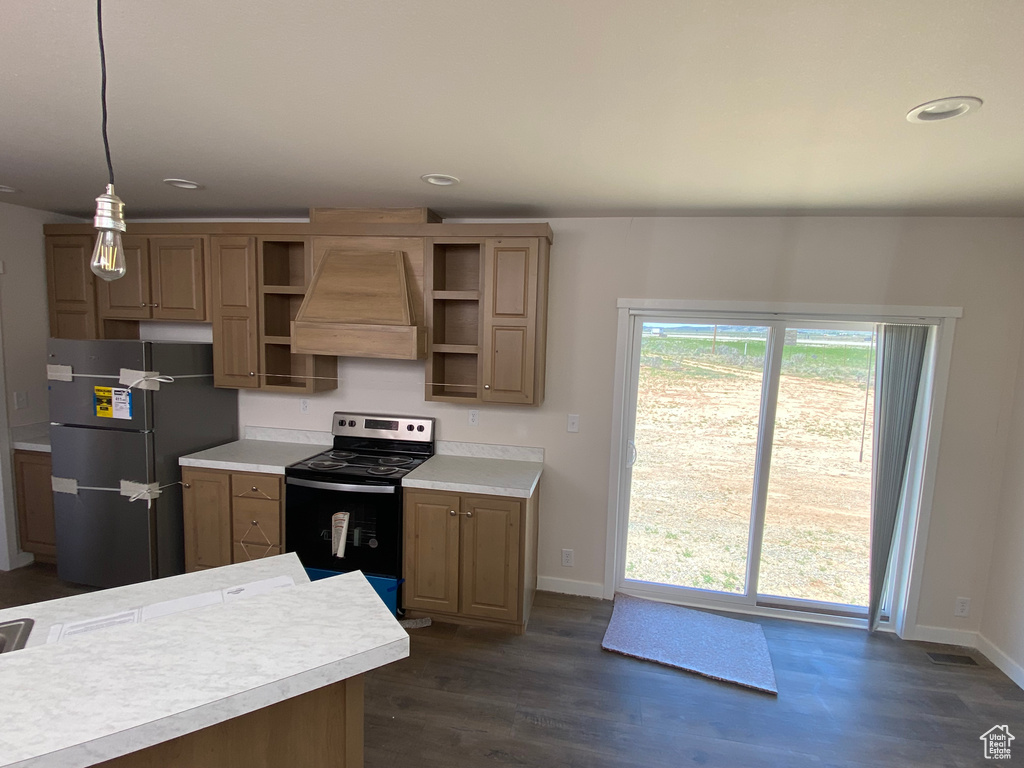 Kitchen with freestanding refrigerator, electric stove, premium range hood, open shelves, and light countertops