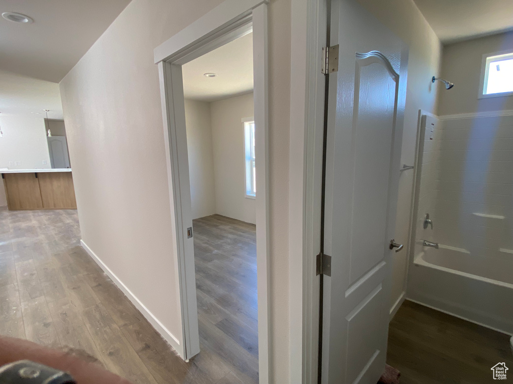 Hall featuring wood finished floors