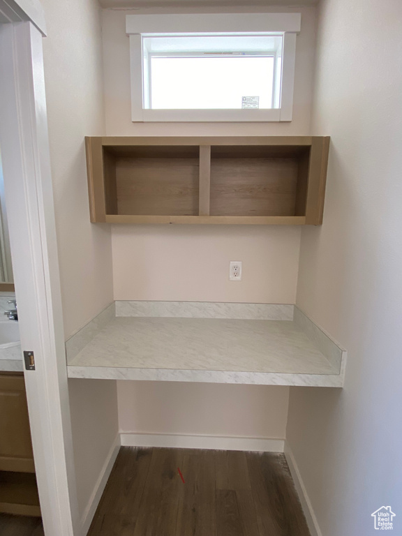 Detailed view of wood finished floors and baseboards