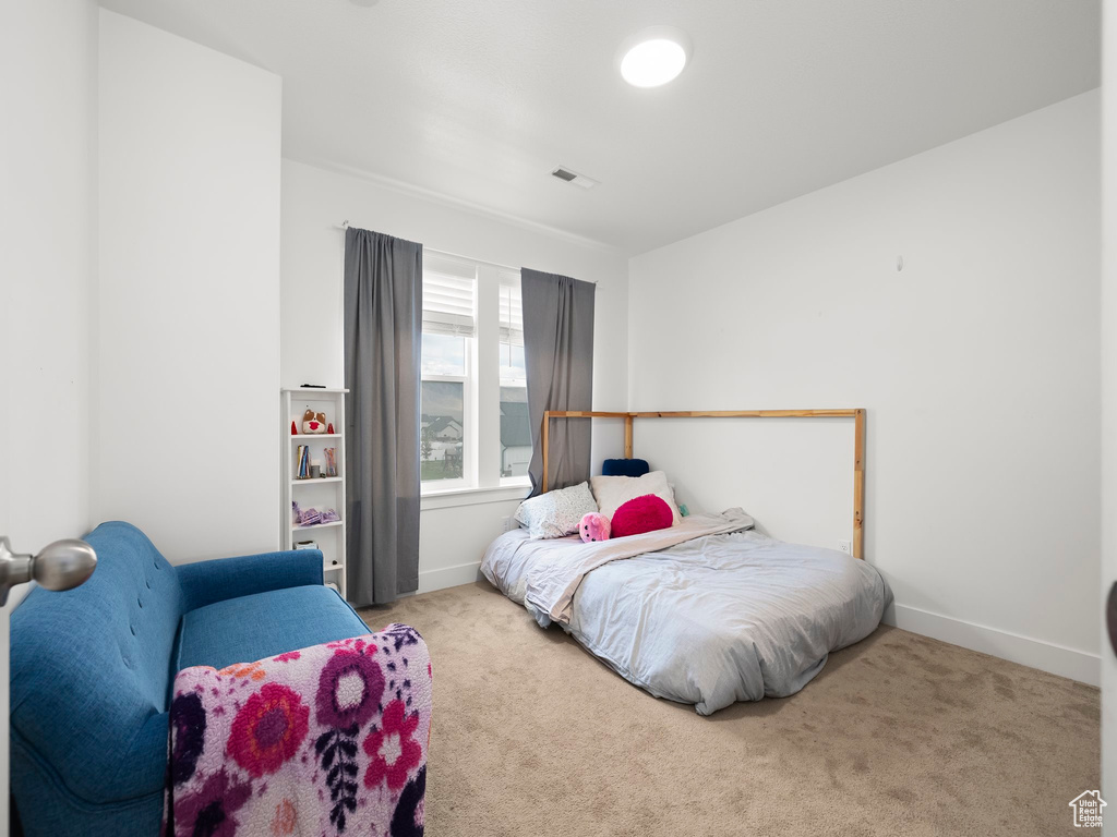 Bedroom with carpet and baseboards