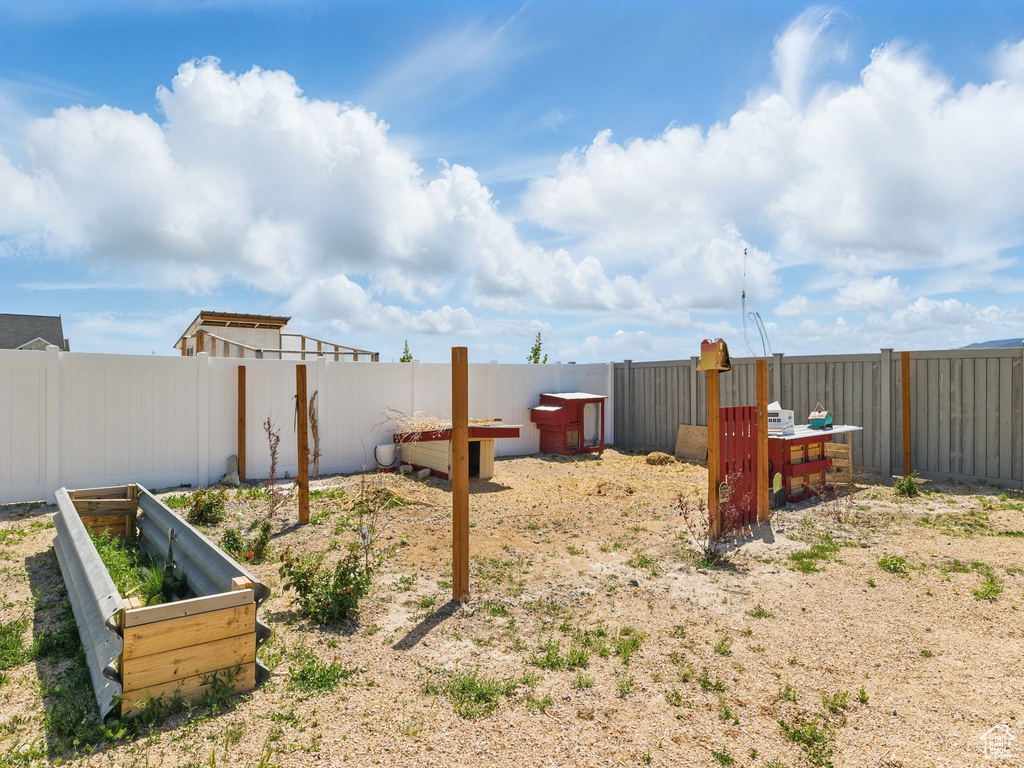 View of fenced backyard