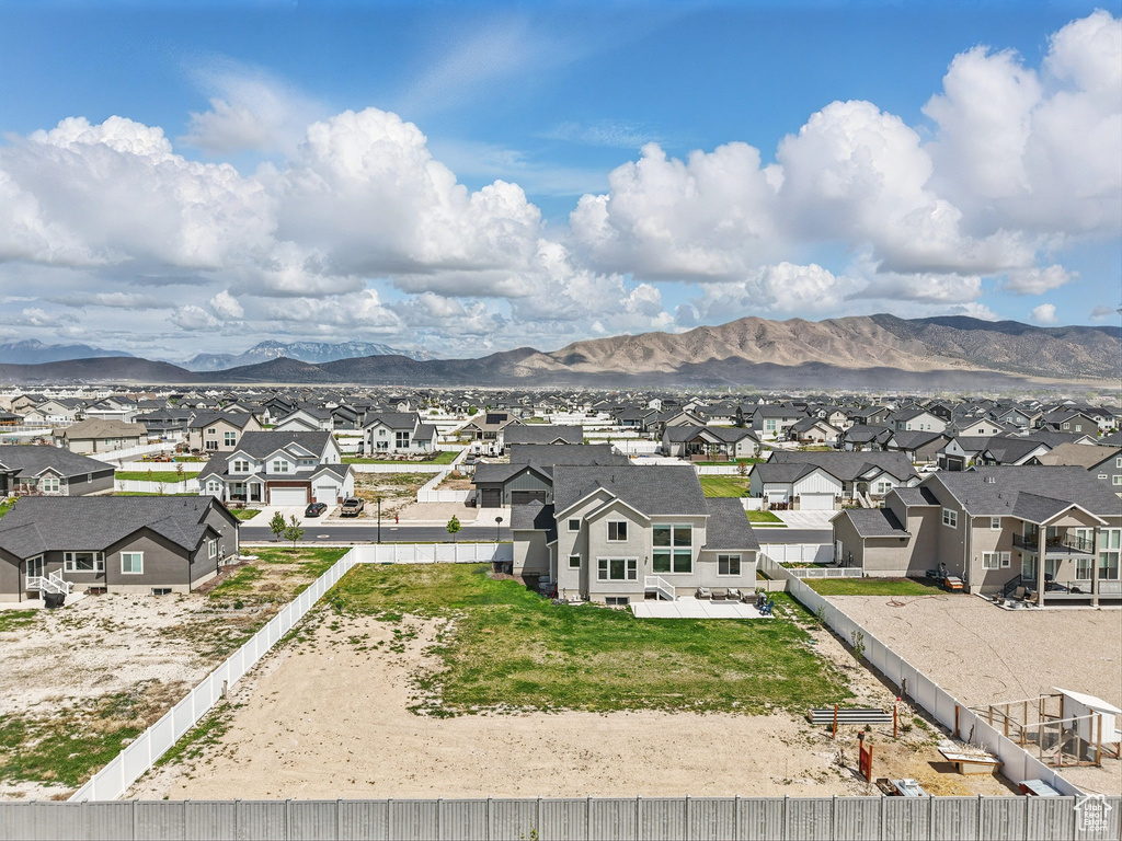 Aerial view of residential area featuring a mountain backdrop