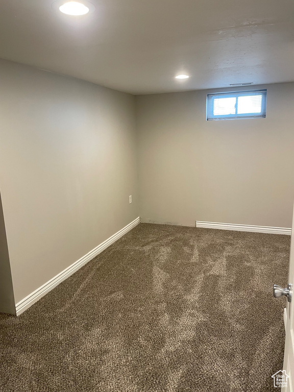 Below grade area with carpet and baseboards