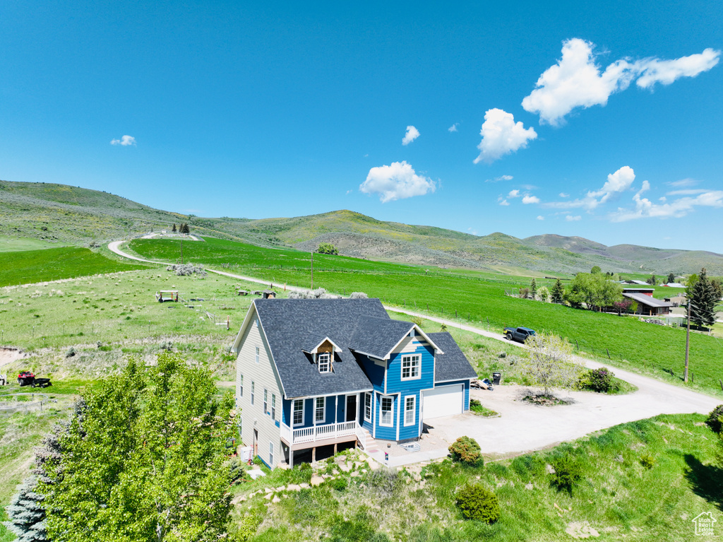 Overview of rural landscape featuring a mountain backdrop