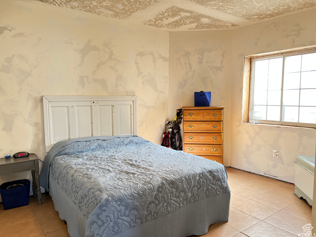 Bedroom featuring light tile patterned floors