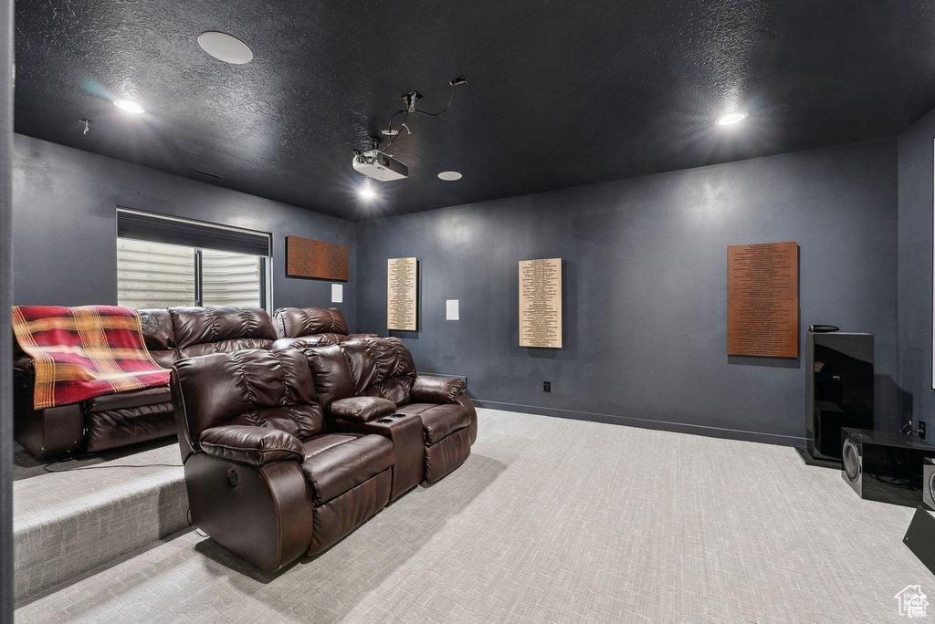 Home theater with carpet floors, recessed lighting, and a textured ceiling