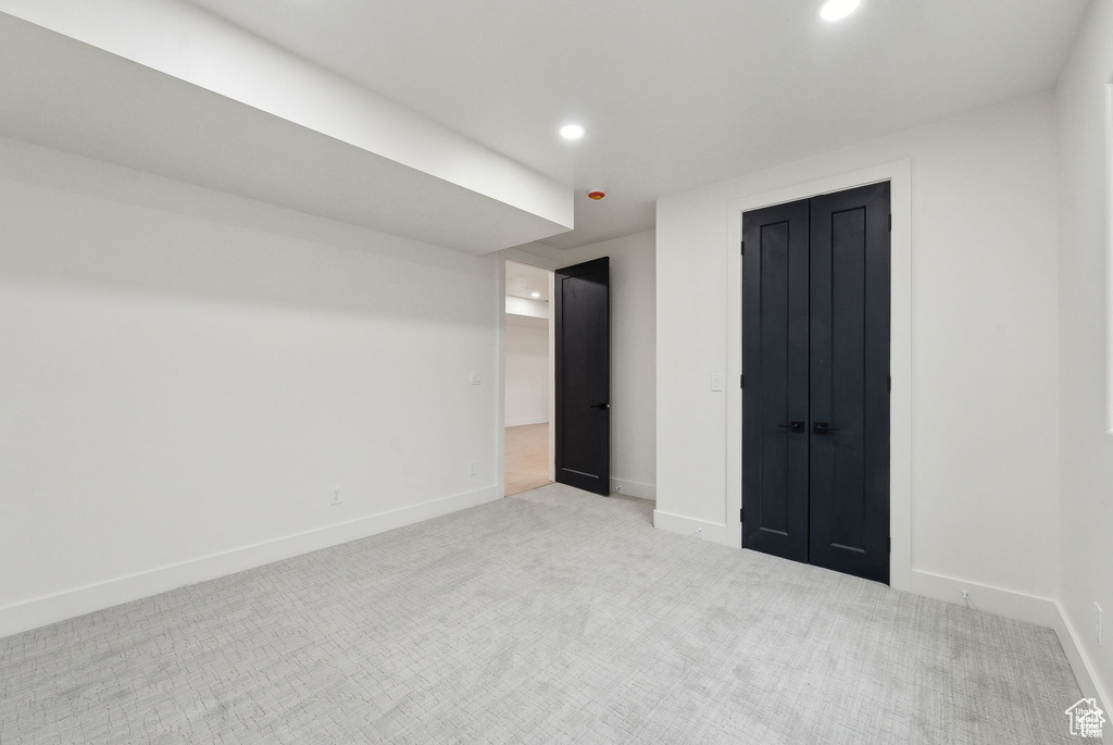 Unfurnished bedroom with carpet floors, baseboards, and recessed lighting