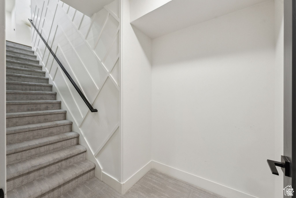 Stairway featuring baseboards