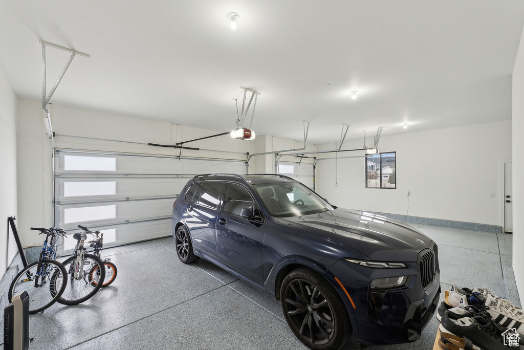 Garage featuring a garage door opener
