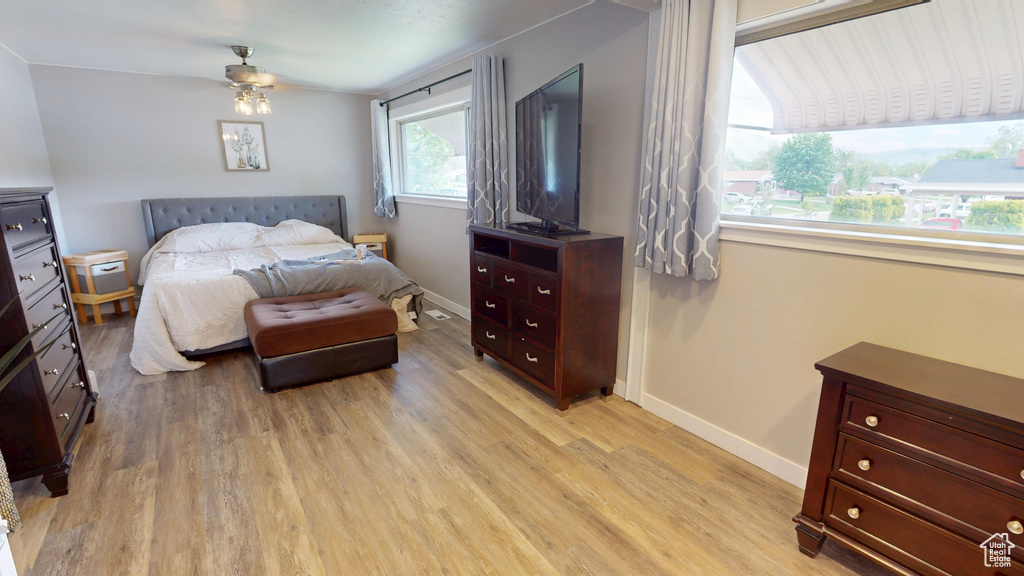 Bedroom featuring light wood-type flooring and baseboards