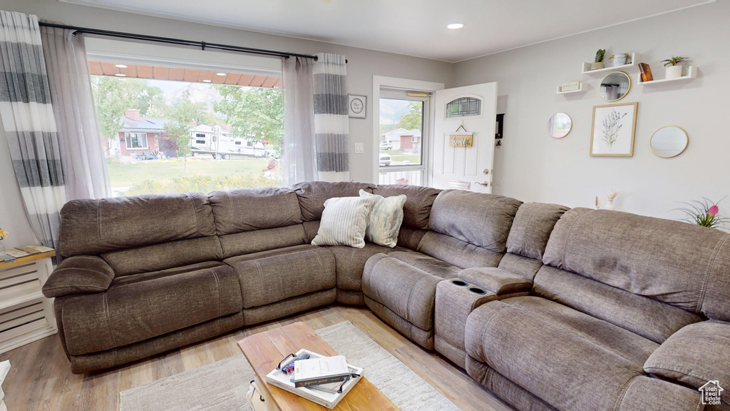 Living room with wood finished floors and recessed lighting