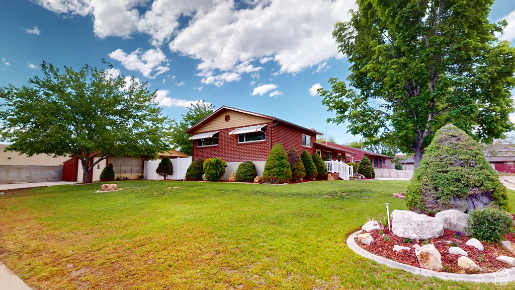 View of side of home with brick siding